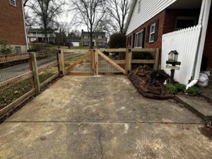 A newly installed wood fence with a double gate by Superior Fence & Rail of Northern Kentucky in Florence, KY.