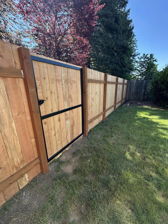 A close-up view of a newly installed wood fence gate by FJ'S Fencing & Construction, LLC in Lake Oswego, OR.