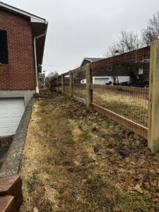 A wood fence installation in progress, showing posts and rails, by Superior Fence & Rail of Northern Kentucky in Florence, KY.