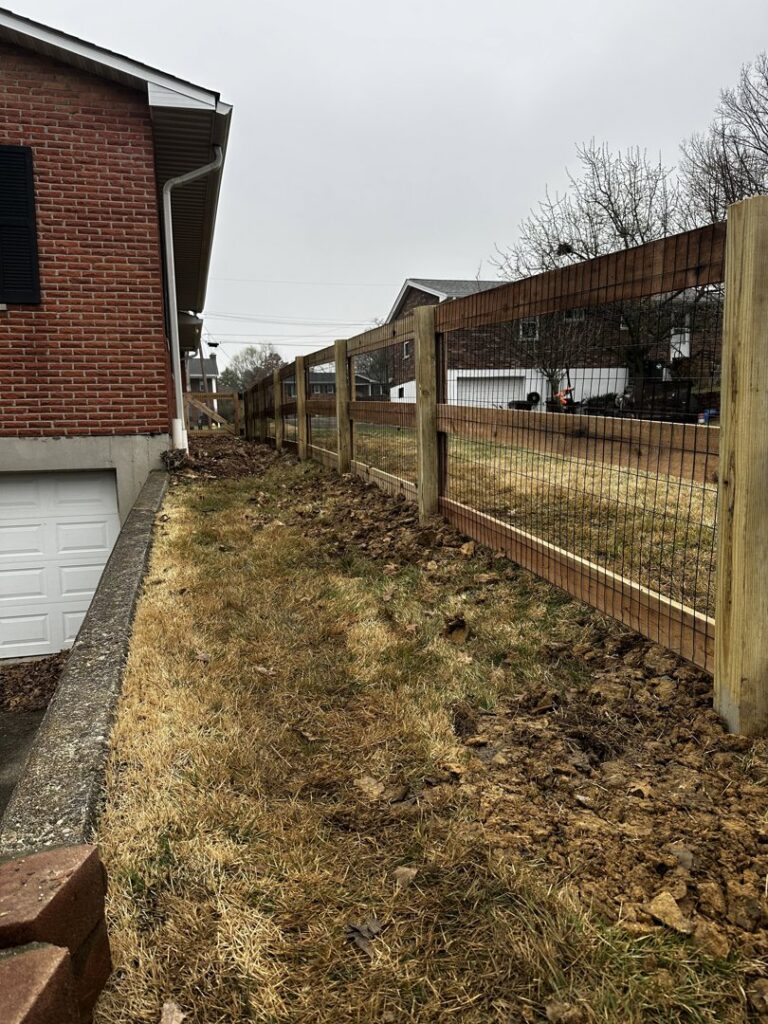 A wood fence installation in progress, showing posts and rails, by Superior Fence & Rail of Northern Kentucky in Florence, KY.