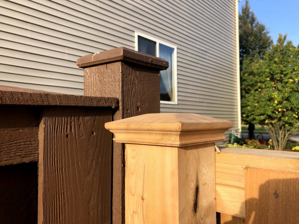 Close-up of new and stained wood fence post styles by Cedar Mountain Fence Company in Plainfield, IL.