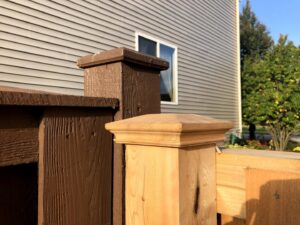 Close-up of new and stained wood fence post styles by Cedar Mountain Fence Company in Plainfield, IL.