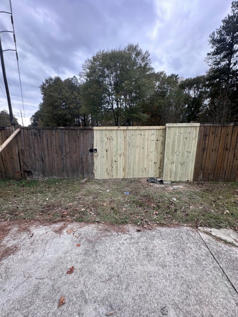 A new wood fence section replacing an older fence, installed by Right Now Fencing, LLC in Johns Creek, GA