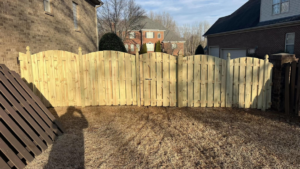A new wood fence with a double gate replacing an old fence, installed by Precision Contracting LLC in Jupiter, FL.