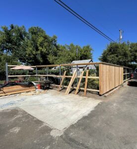 A wood fence under construction, showing posts and initial paneling by RPB Fence in Salem, OR