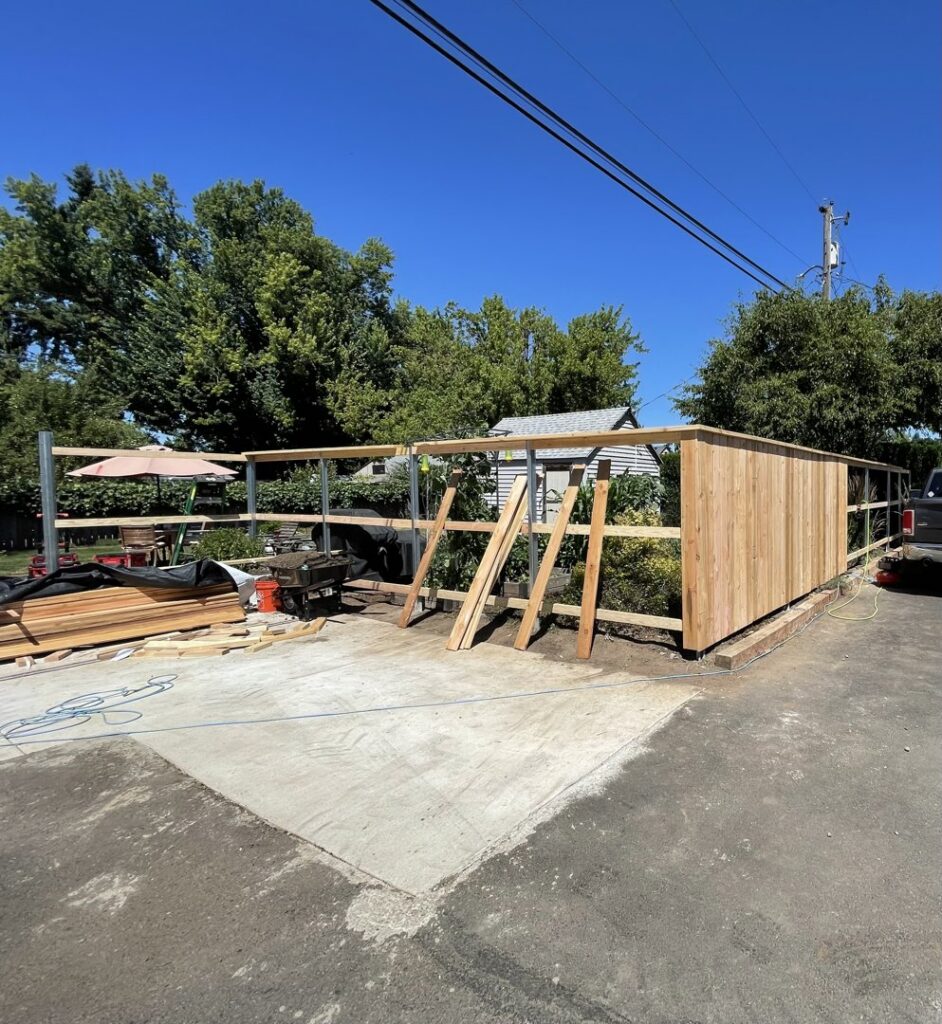 A wood fence under construction, showing posts and initial paneling by RPB Fence in Salem, OR