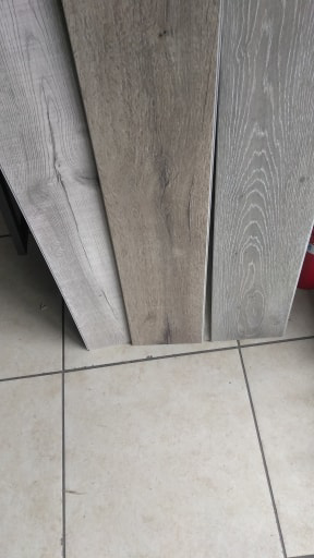 Close-up of wood and laminate flooring samples available at The Carpet Plaza in Bakersfield, CA