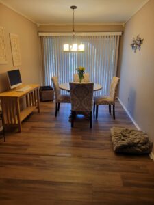 New wood-look flooring installed in a dining area by Nations Best Flooring & Carpet Co. in Livonia, MI.