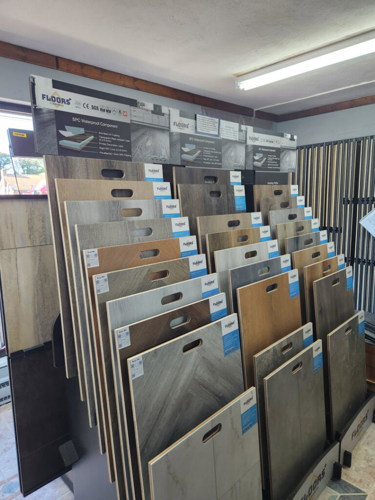A showroom display featuring various wood-look flooring samples at Jerry's Carpet Sales and Service in York, PA.