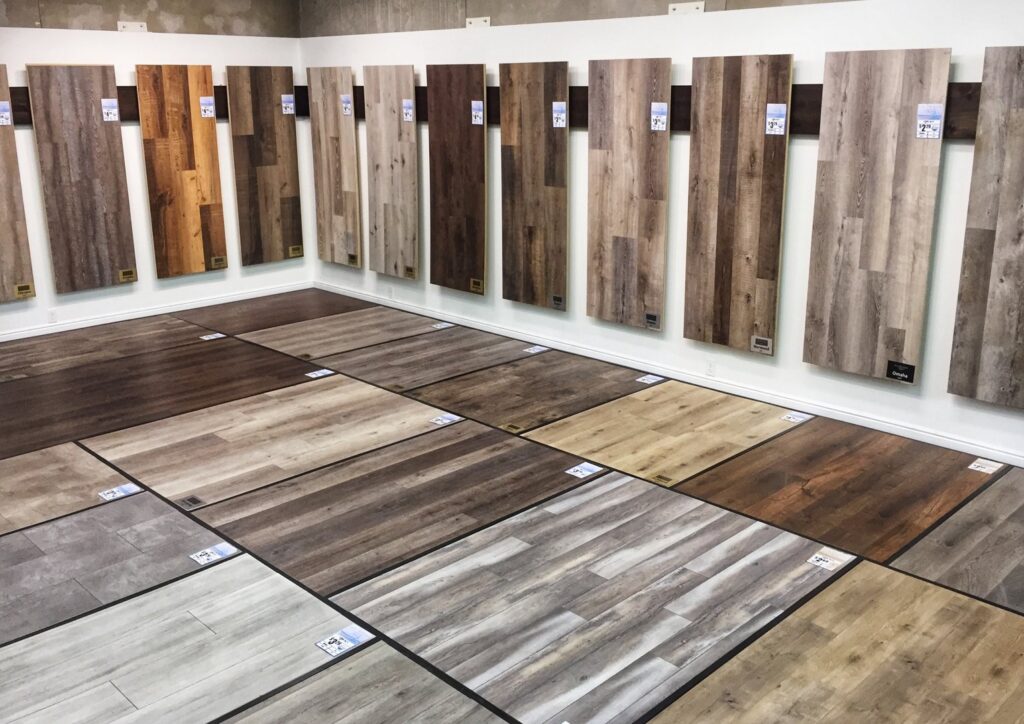 A showroom display of various wood-look flooring samples at Taylor Carpets & Flooring in Provo, UT