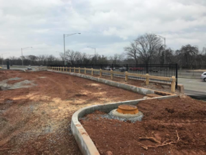 A long stretch of wood post-and-rail fence with black metal fencing installed by Keith's Fence Co LLC in Edison, NJ.