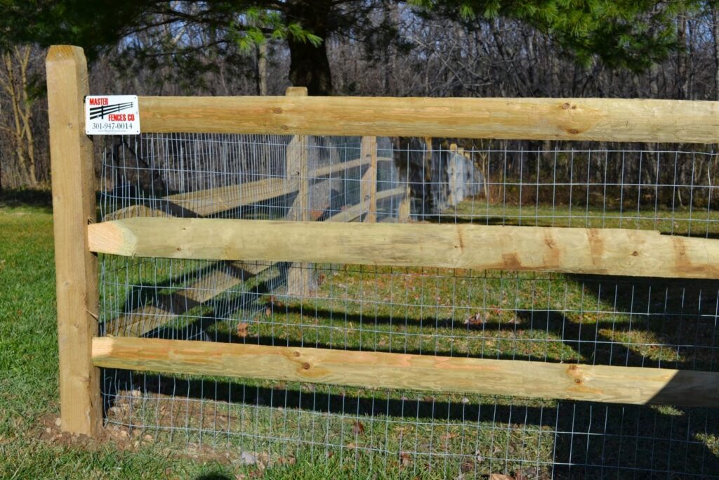 A wood post and wire mesh fence installed by Master Fences, suitable for rural or animal enclosures in Gaithersburg, MD.