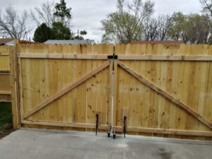 A newly installed wood privacy double gate by Stewart & Son Gate & Fence Co. in Hillsboro, OR