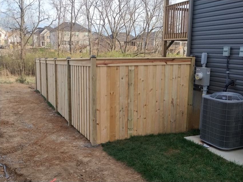 A new wood privacy fence installed around an AC unit by Veteran Fence in North Royalton, OH.