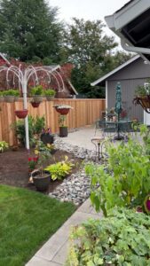 A wood privacy fence enclosing a landscaped backyard, installed by Clark County Fence LLC in Vancouver, WA.
