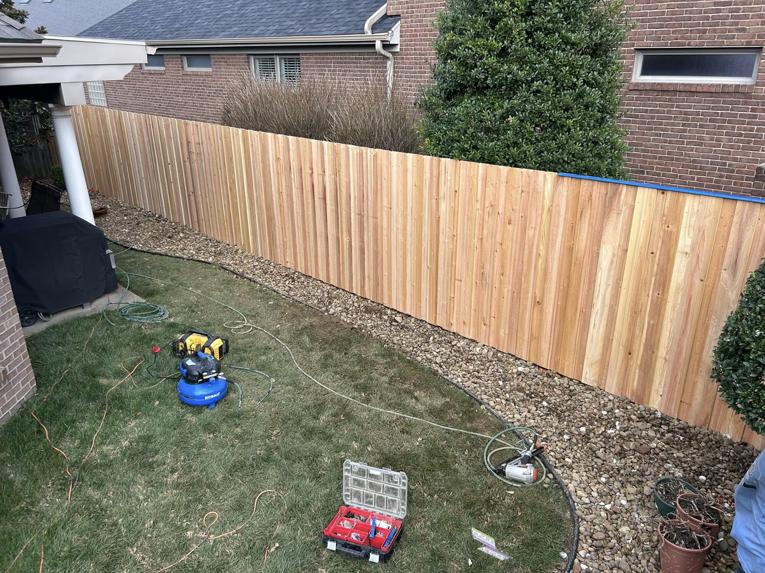 A wood privacy fence under construction by Rager Fencing & Lawn Care, LLC in Owensboro, KY.