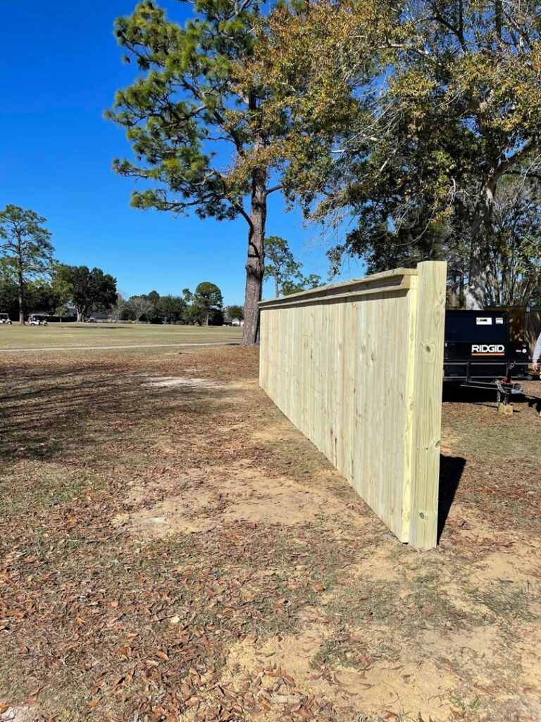 A sturdy wood privacy fence end section installed by Deep South Services LLC in Biloxi, MS.