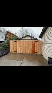 A completed wood privacy fence and gate installation by Supreme Fencing Denver, CO.