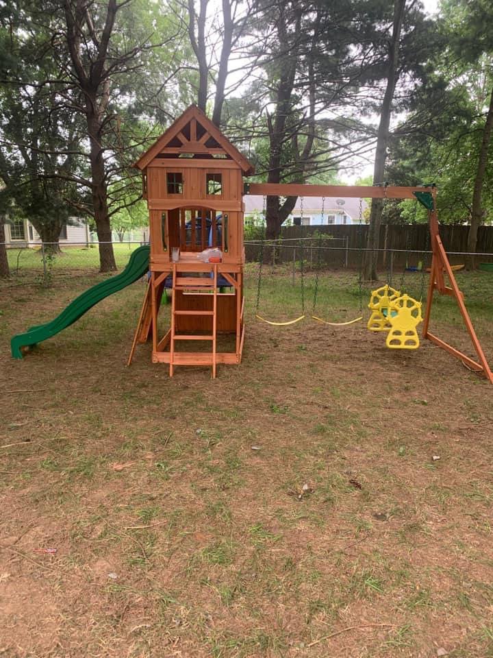 New wood privacy fence sections being installed in a residential backyard by Preston's Fencing and Decks LLC in Murfreesboro, TN.