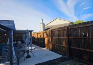 A wood privacy fence with integrated outdoor lighting installed by Barney's Landscaping in Dayton, OH.