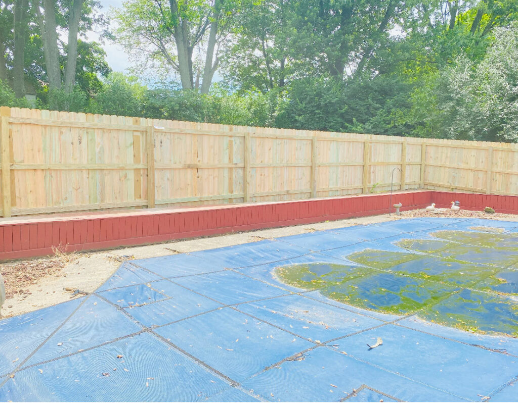 A completed wood privacy fence surrounding a pool area by Superior Fence & Rail of Northern Kentucky in Florence, KY.