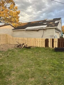 A new wood privacy fence section installed, replacing or extending an older fence by Budget Fence of Ohio in Cleveland, OH.