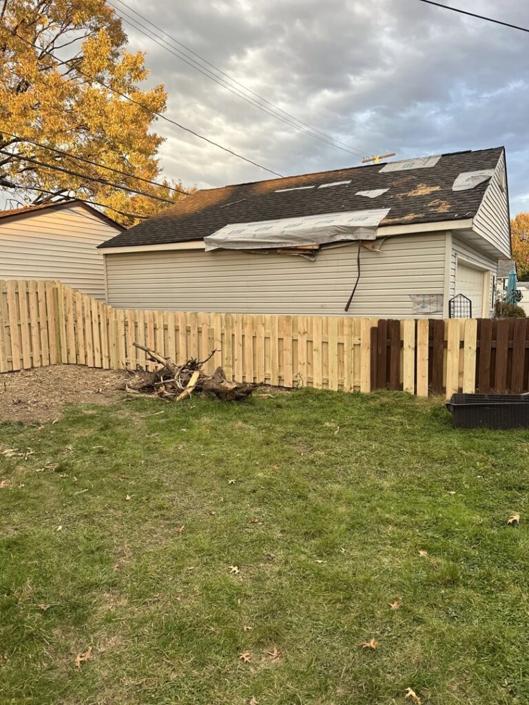A new wood privacy fence section installed, replacing or extending an older fence by Budget Fence of Ohio in Cleveland, OH.