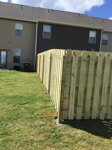 A new wood privacy fence installed in a residential backyard by Castillo Fences in Sacramento, CA.