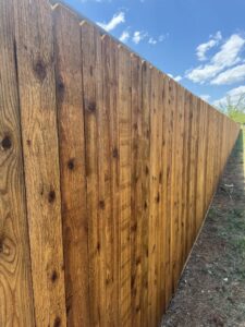 Close-up view of a newly installed wood privacy fence showcasing the natural wood texture by Dallas Fence in Dallas, TX.