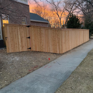 A custom wood privacy fence with a gate, expertly installed by Solid Fence LLC in Golden, CO.