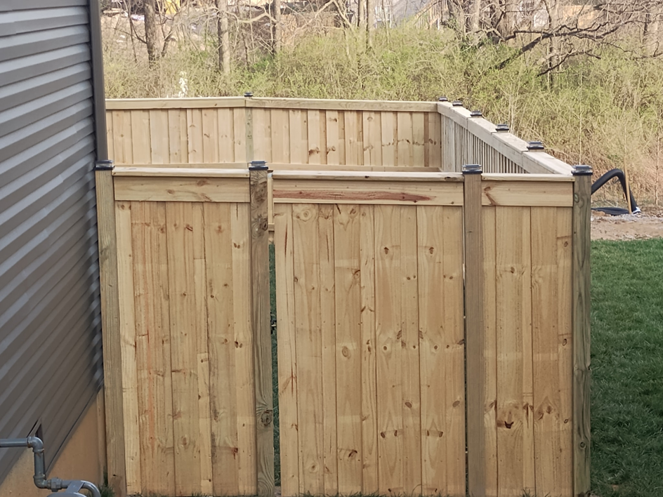 A new wood privacy fence with a gate installed by Veteran Fence in North Royalton, OH.