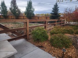 A rustic wood split-rail fence with wire mesh, installed by R&S Fencing & Design LLC in Denver, CO.