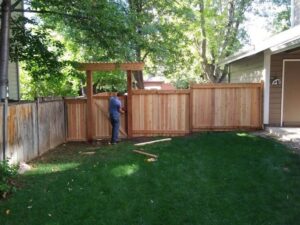 A durable wooden fence with wire mesh panels, suitable for residential or animal enclosures, installed by Best Boy's Fencing in Fort Collins, CO.