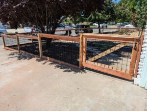 A wood and wire mesh fence with a matching gate installed by Sacramento Valley Fencing in Sacramento, CA.