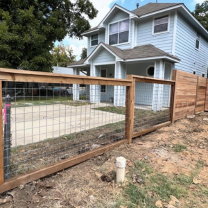 A new wood and wire mesh fence installed in the front yard of a residential home by K.K. Landscaping & Fencing in Austin, TX.