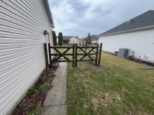 A custom wooden cross-brace gate installed by Premier Fence LLC in Canton, MA.