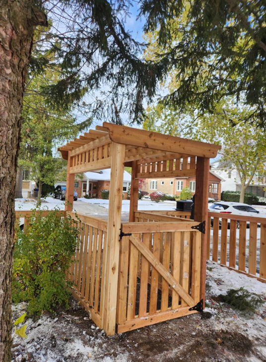 A newly installed wooden fence and gate structure with a pergola top for a residential property by ALL STAR FENCE in Chicago, IL.