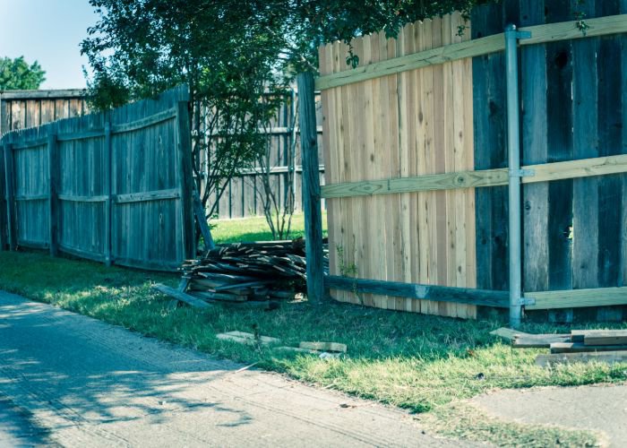 A wooden fence replacement and repair job in progress by Fence Company of Rhode Island in Providence, RI.