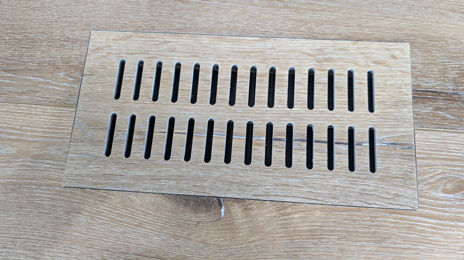 A modern wooden floor vent or register for an HVAC system by BYLT Living in Sandy, UT