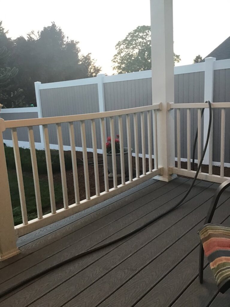 A custom wooden garden fence enclosure with a small gate, built by Fence Repair Master in Vancouver, WA.