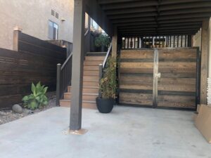 A wooden horizontal slat gate installed by No Limit Fence Company in Huntington Beach, CA.