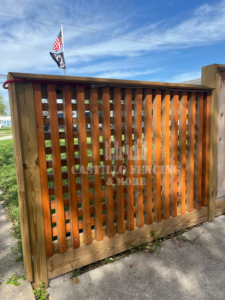 A newly installed wooden lattice fence section by Castillo Fencing & More in Corpus Christi, TX.
