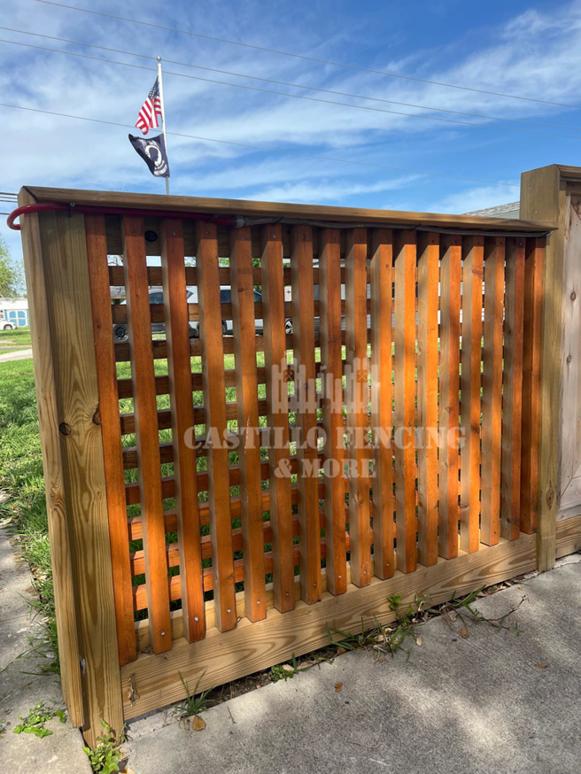 A newly installed wooden lattice fence section by Castillo Fencing & More in Corpus Christi, TX.