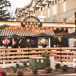 A wooden fence enclosing an outdoor patio area for a restaurant, installed by Northway Fence in Menomonee Falls, WI.