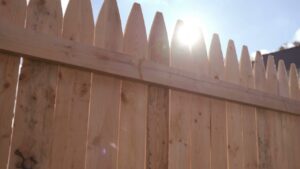A close-up view of a newly installed wooden picket fence by Fix-A-Fence LLC in Portland, OR.