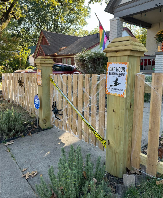 A wooden picket fence decorated for Halloween, showcasing fencing work by Southwest Fence Company Inc in Weatherford, OK.