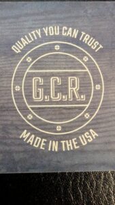 A charming wooden picket fence illuminated by solar lights at night, installed by Gifford Contracting & Repair in Goose Creek, SC.