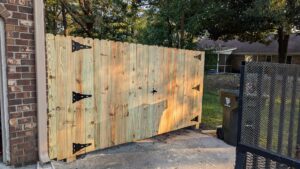 A newly installed wooden privacy fence and gate by Gifford Contracting & Repair - Custom Privacy Fencing in Goose Creek, SC.