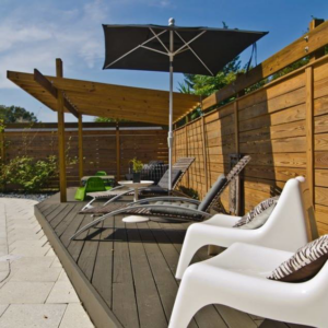 A newly installed wooden privacy fence in a backyard setting by Hernandez Fence in Orlando, FL.