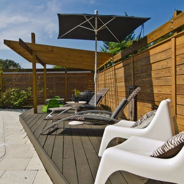 A newly installed wooden privacy fence in a backyard setting by Hernandez Fence in Orlando, FL.